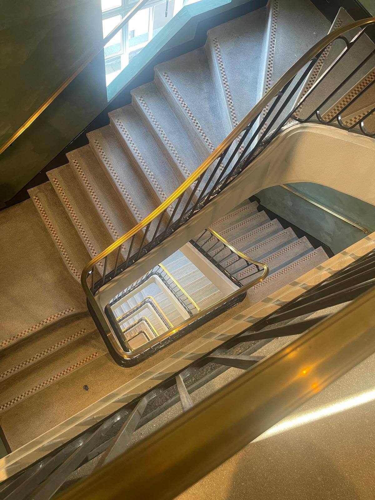 Marble spiral staircase joints sealed in a commercial building
