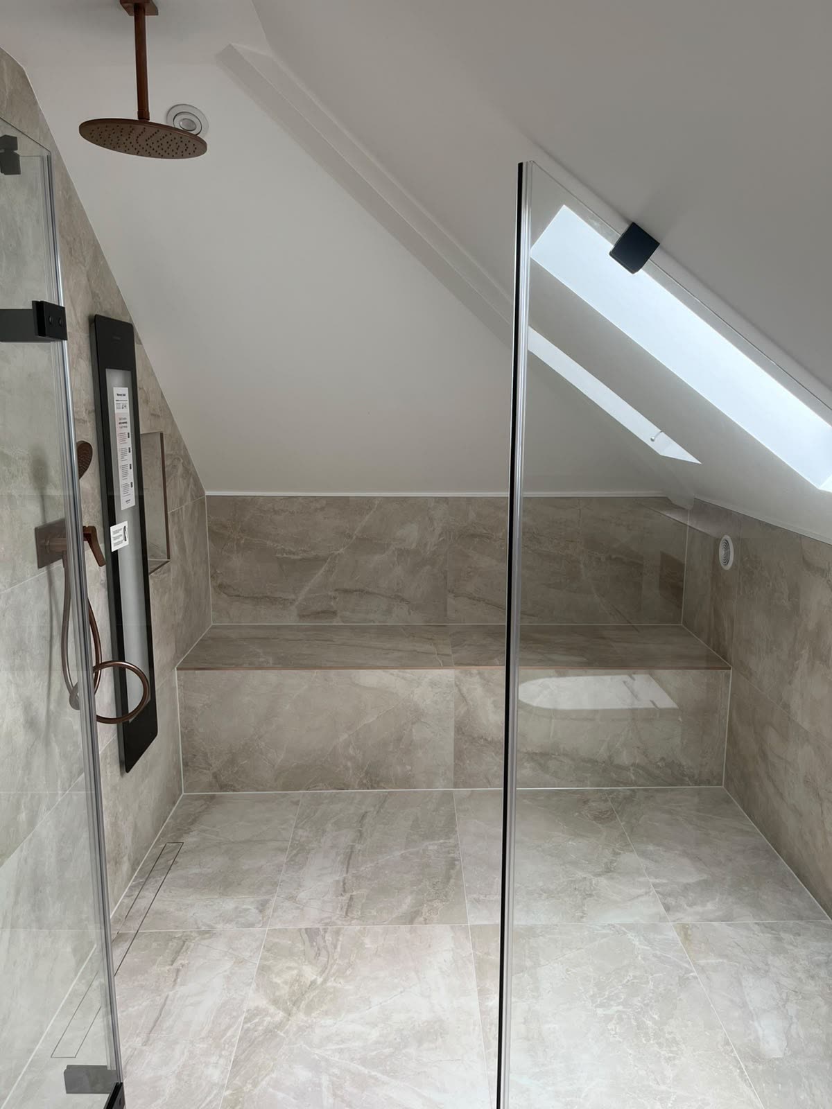 Loft wet room with tiled bench and floor, all internal joints silicone sealed