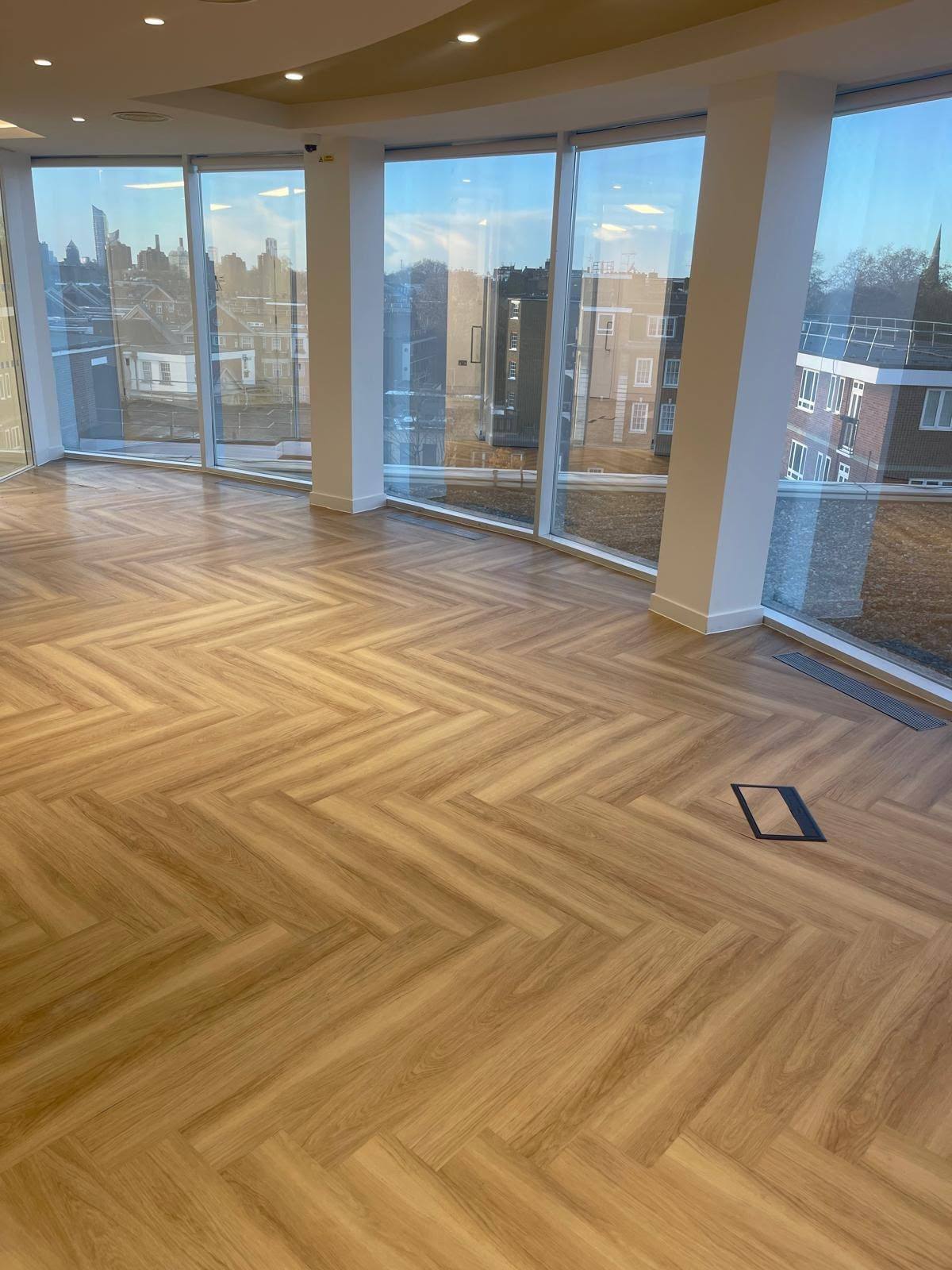 Floor-to-ceiling glazing perimeter sealed in an empty London office space