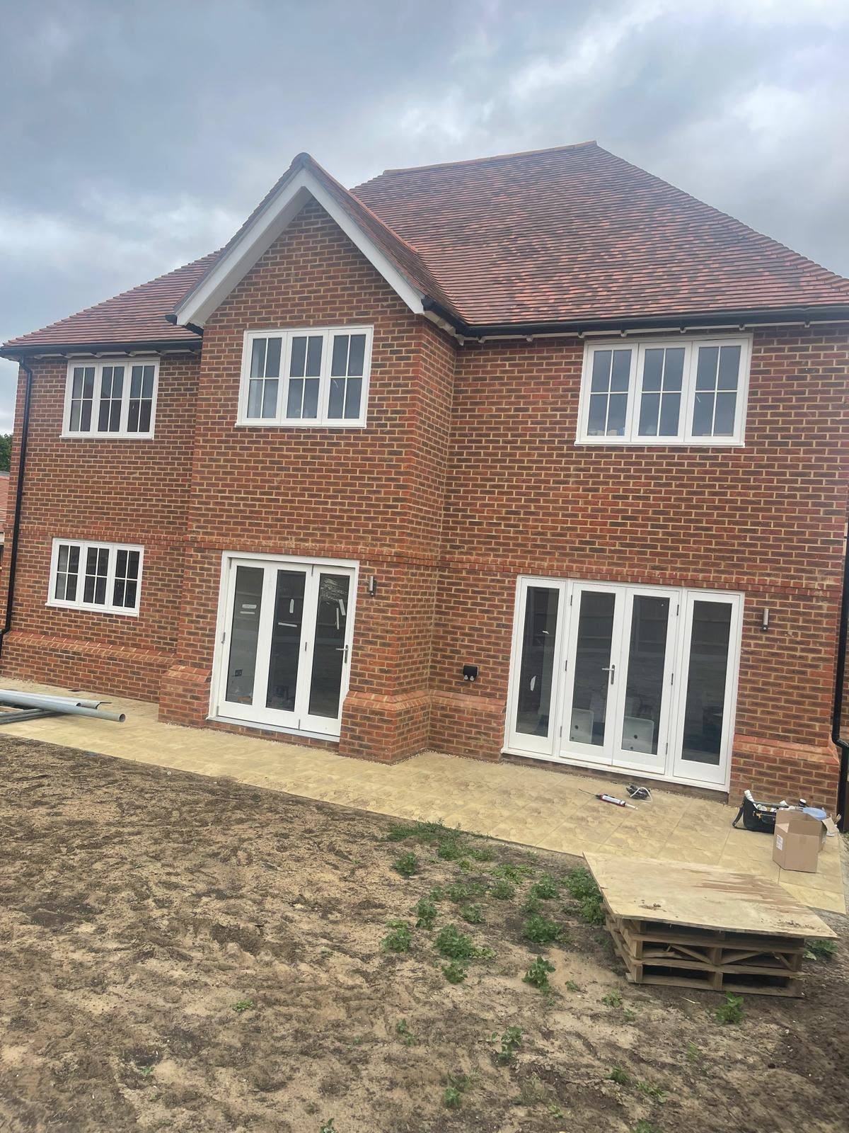 New-build brick house with externally sealed window and door frames