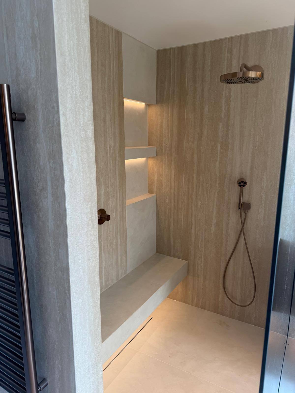 Wet room sealed with mould-resistant white silicone around the shower area
